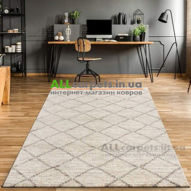 Сучасний ворсовий килим у великій вітальні — ідеальне зонування простору